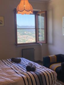 Postel nebo postele na pokoji v ubytování B&B Rox e Claudia