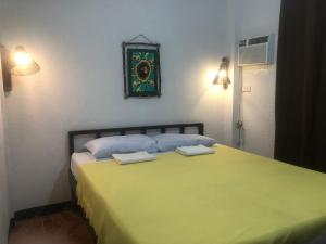 Voodi või voodid majutusasutuse Mylene Room Rental toas