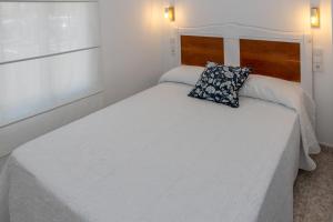 Łóżko lub łóżka w pokoju w obiekcie CHALET VILLA Los HIPOCAMPOS
