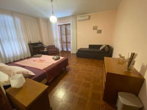 Postel nebo postele na pokoji v ubytování B&B Rox e Claudia
