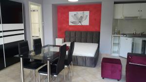 a room with a dining table and a kitchen with a bed at HOPE HOUSE in Kavála +26 photos