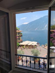 a view from a balcony of a balcony overlooking a city at Albergo Ristorante Montebaldo in Limone sul Garda