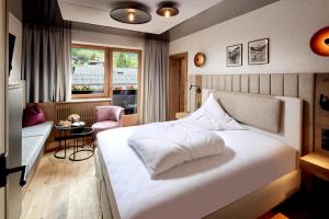 Voodi või voodid majutusasutuse Relais&Châteaux Spa-Hotel Jagdhof toas