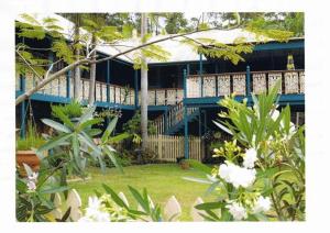 a house with a blue deck and some flowers at Riviera Bed & Breakfast in Gold Coast
