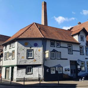 a building with a painting on the side of it at "Bedroo" Ferienwohnung am historischen Hafen in Wanfried