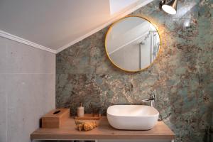 a bathroom with a sink and a mirror at Bogić kuća in Zavala +40 photos