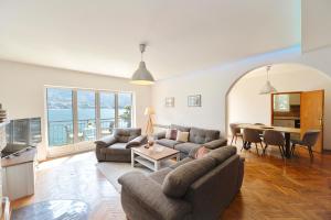 a living room with a couch and a table at House 44 SEAFRONT APARTMENTS in Kotor