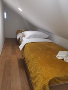 Ein Bett oder Betten in einem Zimmer der Unterkunft Nibela Apartments