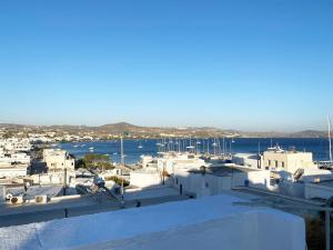 a view of a harbor with boats in the water at Amalthia Apartment Milos, Adamas Town center in Adamantas