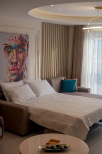 Gulta vai gultas numurā naktsmītnē Luxury Apartments Ivanovic