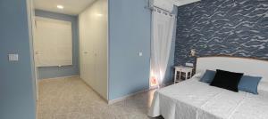 Łóżko lub łóżka w pokoju w obiekcie CHALET VILLA Los HIPOCAMPOS