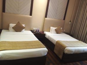Postel nebo postele na pokoji v ubytování Hotel The Vilana A Unit of JG Developers Rishikesh