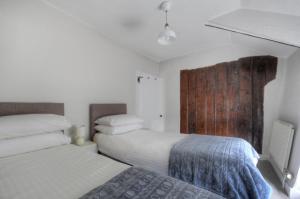 En eller flere senge i et værelse på The Nest