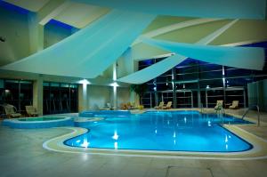 a large swimming pool in a large building at The K Club in Straffan