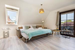 Postel nebo postele na pokoji v ubytování Haus am Strand Ferienwohnung Haus am Strand 5