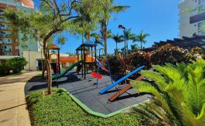 a playground in a park with a slide at Nautilus Paradise em Penha/SC in Penha