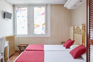 Postel nebo postele na pokoji v ubytování Hotel Dato