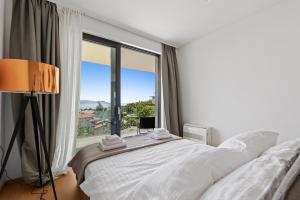 Postel nebo postele na pokoji v ubytování Apartments Villa Zara