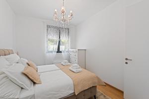 Postel nebo postele na pokoji v ubytování Apartments Villa Zara