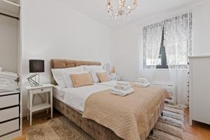 Postel nebo postele na pokoji v ubytování Apartments Villa Zara
