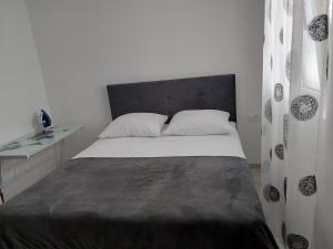 Posteľ alebo postele v izbe v ubytovaní Apartman Iva