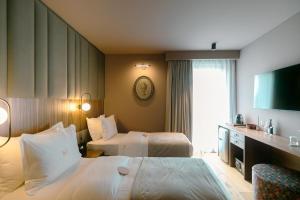 Postel nebo postele na pokoji v ubytování Mert Boutique Hotel
