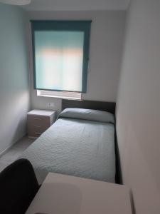 A bed or beds in a room at Precioso piso 3 dormitorios, aire acondicionado Jerez de la Frontera