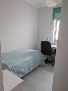 A bed or beds in a room at Precioso piso 3 dormitorios, aire acondicionado Jerez de la Frontera