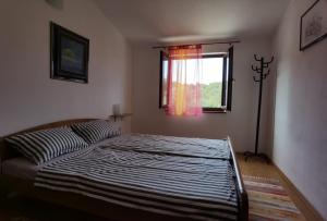 Postel nebo postele na pokoji v ubytování Apartmani Ruk