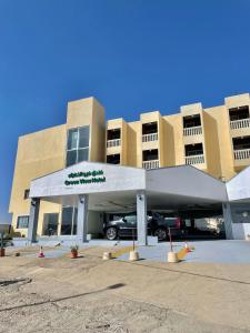 a parking lot in front of a building at Green View Hotel in Abha