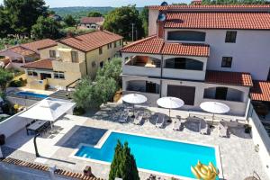 an aerial view of a villa with a swimming pool at Apartment Nina with private pool in Nova Vas