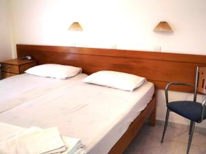 Postel nebo postele na pokoji v ubytování Dimitra Hotel
