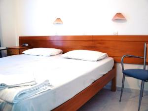 Postel nebo postele na pokoji v ubytování Dimitra Hotel