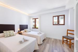A bed or beds in a room at Albercutx Pollentia 3