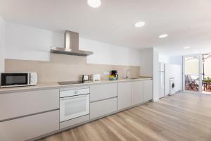 A kitchen or kitchenette at Albercutx Pollentia 3