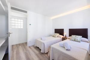 A bed or beds in a room at Albercutx Pollentia 3