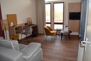 Μια τηλεόραση ή/και κέντρο ψυχαγωγίας στο Fletcher Duinhotel Hotel Burgh Haamstede