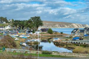 a group of boats are docked in a harbor at 7 Pen y Bont in Abersoch