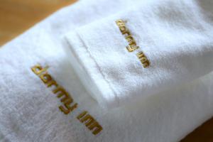 a white napkin with the word hotel on it at Dormy Inn Express Fujisan Gotemba in Gotemba