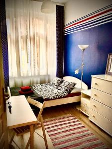 a small bedroom with a bed and a window at Kwatera Prywatna Marini in Sopot