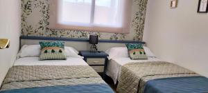 En eller flere senge i et værelse på Concordia, con parking en el puerto de Cambrils