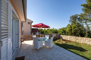 Patio alebo iná vonkajšia časť ubytovania Villa Il Giardin