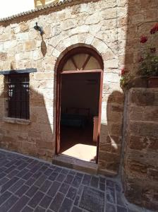 an entrance to a brick building with an open door at Katerina Traditional Rooms in Chania Town