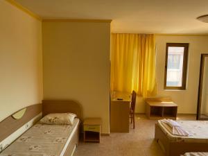 Postel nebo postele na pokoji v ubytování Hotel Apart