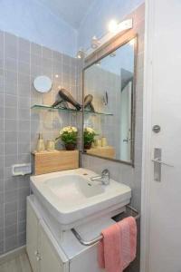 a bathroom with a sink and a mirror at CapSaSalBegur74 Terraza sobre Mar, Piscina del Mar in Begur