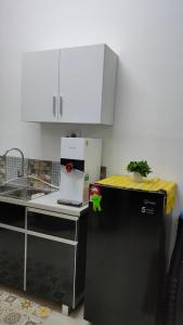 A kitchen or kitchenette at Embon Homestay