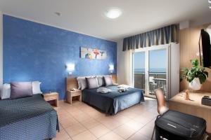 Postel nebo postele na pokoji v ubytování Hotel Souvenir - Koolibry Hotels