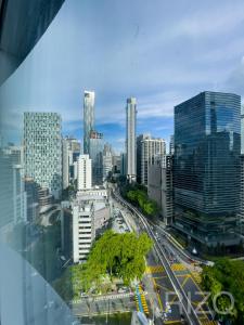 a city view of a city with a highway at vortex suites klcc by LEAVA in Kuala Lumpur