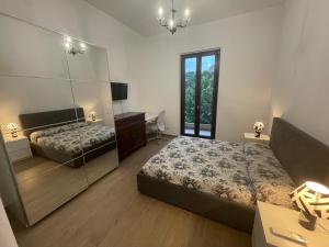Casa Drema - Villa al mare con terrazza客房内的一张或多张床位