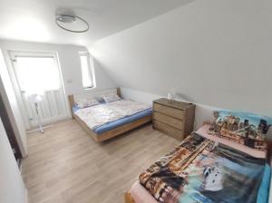Postel nebo postele na pokoji v ubytování Farářova vyhlídka